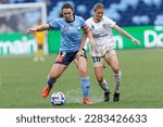 Small photo of Sophie Stapleford of Newcastle competes for the ball with Natalie Tobin of Sydney during the match between Sydney and Newcastle at Allianz Stadium on April 1, 2023 in Sydney, Australia