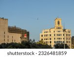 Small photo of Barcelona, Spain; July 2 2023: Nathan Paulin, a French tightrope walker, balances himself at a height of 70 m to cover 350 m over Placa Catalunya for the inauguration of the Grec theatre festival.