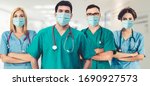 Small photo of Coronavirus hospital staff - Doctor, surgeon and nurse with medical mask in hospital to fight coronavirus. Epidemic outbreak of coronavirus cause severe hospital occupancy and shortage of staff.