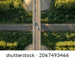 Small photo of Aerial top down view over highway viaduct via railway. Drone view of bridge with cars over railroad. Crossing railway line and motorway