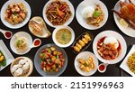 Small photo of Top view food platter combo set of traditional Cantonese yum-cha Asian gourmet cuisine meal food dish on the white serving plate on the table, includes dishes of duck, pork, fish, chicken, vegetables