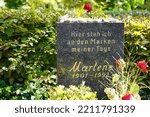 Small photo of Berlin, Germany - October 9, 2022: Honorary grave of Marlene Dietrich decorated with small stones in Berlin's Friedenau district