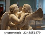 Small photo of Berlin, Germany - August 17, 2023: Close-up a statue group showing Amor and Psyche in Altes Museum on Museum Island in Berlin