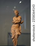 Small photo of Berlin, Germany - September 7, 2023: Terracotta statuette of Aphrodite known as Aphrodite Heyl from the second century BC in Altes Museum in Berlin