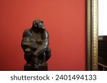 Small photo of Berlin, Germany - December 16, 2023: Chimpanzee ("Missie") sculpture by Anton Puchegger in Alte Nationalgalerie in Berlin