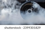 Small photo of Car burnout wheels tire with white smoke,Car wheel burnout with smoke from the spinning tyre, Drag car wheel burns tires preparation for the race.