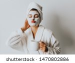 Beautiful Luxury Life. Breakfast. Happy Girl with a Cup of Coffee. Home Style Relaxation Woman Wearing Bathrobe and Towel after Shower. Spa Good Morning.Cosmetic procedure. Beauty spa and cosmetology.