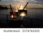 sunset coctail at lake of constance. during summertime at bodensee the drinks taste even better with a warm breeze in the afternoon and sunset.