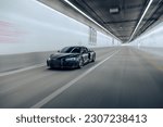 Small photo of Seattle, WA, USA May 23, 2023 Audi R8 driving in a tunnel showing the front of the car