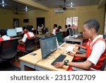 Small photo of Onitsha, Anambra State, Nigeria - June 2, 2023: A black secondary school student operating a computer
