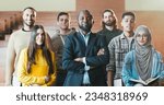 Small photo of Portrait shot of African American male happy professor among mixed-races students in auditorium of University laughing n front of camera. Teacher and pupils concept. Posing for photo.