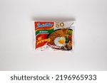 Small photo of Jakarta, Indonesia - September 2nd, 2022: The infamous Indomie Mi Goreng (Fried Noodle) isolated with white background.