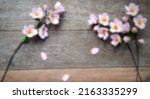 Small photo of Defocused abstract background of sakura felt flower - DIY Felt Craft Cherry Blossom Felt Flowers.