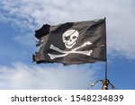 Jolly Roger Pirate Flag On Blue ...