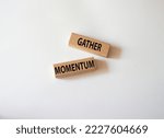 Small photo of Gather momentum symbol. Wooden blocks with words Gather momentum. Beautiful white background. Business and Gather momentum concept. Copy space.