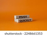 Small photo of Pivot quickly symbol. Wooden blocks with words Pivot quickly. Beautiful orange background. Business and Pivot quickly concept. Copy space.
