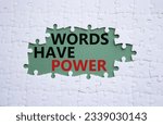 Small photo of Words have power symbol. White puzzle with words Words have power. Beautiful grey green background. Business and Words have power concept. Copy space. Concept word. Concept word
