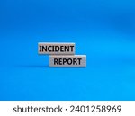 Small photo of Incident Report symbol. Concept word Incident Report on wooden blocks. Beautiful blue background. Business and Incident Report concept. Copy space