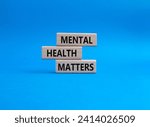 Small photo of Mental Health Matters symbol. Concept words Mental Health Matters on wooden blocks. Beautiful blue background. Healthcare and Mental Health Matters concept. Copy space.