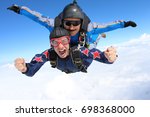 Skydiving. tandem passenger is...