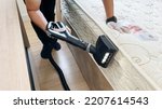 Small photo of Close-up professional cleaning and sanitizing services use vacuum cleaner to clean and get rid of dust mites from a mattress in the bedroom.