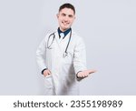Small photo of Friendly doctor extending hand in welcome isolated. Happy doctor extending hand to camera. Cheerful doctor extending hand welcome