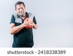 Small photo of Senior man with tachycardia touching his chest. Elderly person with heart problems. Old man with heart pain touching chest isolated