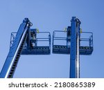 Group of aerial work platforms for construction and material handling. Close-up to the basket for moving people