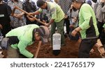 Small photo of The public cemetery complex (TPU) at Karet Bivouac, people making pilgrimages, funeral officials, people sowing flowers. Jakarta-Indonesia-December 2022.