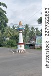Small photo of Jembrana March 23, 2023, view of the monument sign that stands tall in the middle of the crossroad in Cupel Village, Negara District, Jembrana Regency, Bali