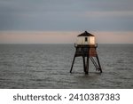 Small photo of Lighthouse in the sea at sunset, Dovercourt low lighthouse at high tide built in 1863 and discontinued in 1917 and restored in 1980 the 8 meter lighthouse is still a iconic sight