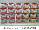 Small photo of PENANG, MALAYSIA - 16 APR 2021: Emmi swiss premium yogurt display on open fridge shelf close up. Emmi AG is a Swiss milk processor and dairy products company headquartered in Lucerne.