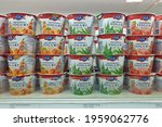 Small photo of PENANG, MALAYSIA - 16 APR 2021: Emmi swiss premium yogurt display on open fridge shelf close up. Emmi AG is a Swiss milk processor and dairy products company headquartered in Lucerne.