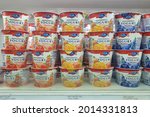 Small photo of PENANG, MALAYSIA - 21 JULY 2021: Emmi swiss premium yogurt display on open fridge shelf close up. Emmi AG is a Swiss milk processor and dairy products company headquartered in Lucerne.