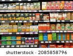 Small photo of PENANG, MALAYSIA - 10 NOV 2021: Various brands of local and imported premium tea and flavouring tea on the store shelves. Tea and juice are often consumed for their perceived health benefits.