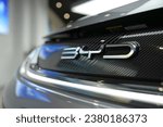 Small photo of PENANG, MALAYSIA - 20 OCT 2023: Car logo of a BYD Build Your Dreams EV car. BYD Co. Ltd. is a publicly listed Chinese conglomerate manufacturing company headquartered in Shenzhen, Guangdong, China.