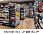 Small photo of PENANG, MALAYSIA - 1 DEC 2023: Wine bottles and liquor are showcased on store shelves. These alcoholic drinks are made by distilling grains, fruits, or sugar after undergoing alcoholic fermentation.