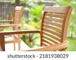close up of wooden chairs on the terrace suitable for furniture ideas. selective focus wooden chair garden grasshopper background