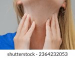 Small photo of Sore throat, touch the neck near the larynx