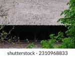 The Roof Of A Large House With...