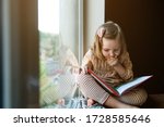 Little Girl Is Reading A Book...