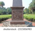 Small photo of a monument in the Bogor Botanical Gardens, where the monument reads "geplaatst dour zyne vrienden en vereerders in 1884". Bogor, Botanical Garden - April 21 2023.