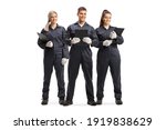 Small photo of Full length portrait of a team od female and male mechanics in uniforms isolated on white background