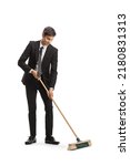 Businessman sweeping with a...