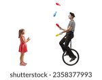 Small photo of Full length profile shot of a girl clapping and looking at a mime juggling and riding a unicycle isolated on white background