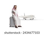 Small photo of Saudi arab man sitting on a suitcase and thinking, cancelled or a delayed flight concept isolated on white background