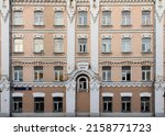 Vintage architecture classical old brick  brown facade building with central arched window front view