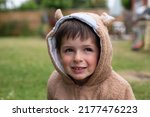 Little boy wearing a teddy hoodie