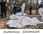 Small photo of Izyum, Kharkiv Oblast, Ukraine. September 17, 2022. Exhumation of 450 bodies from a mass grave. Most of the victims were tortured and killed during Russian occupation. There were children among them.