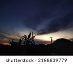 Small photo of dawn of sunrise that irradiate near bank of lake toba